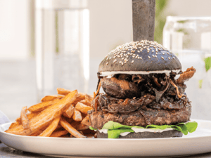 Charcoal bun beef burger with chips