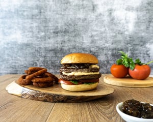 Burger with curly fries.