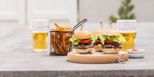 Selection of Angel Bay sliders next to chips and drink.